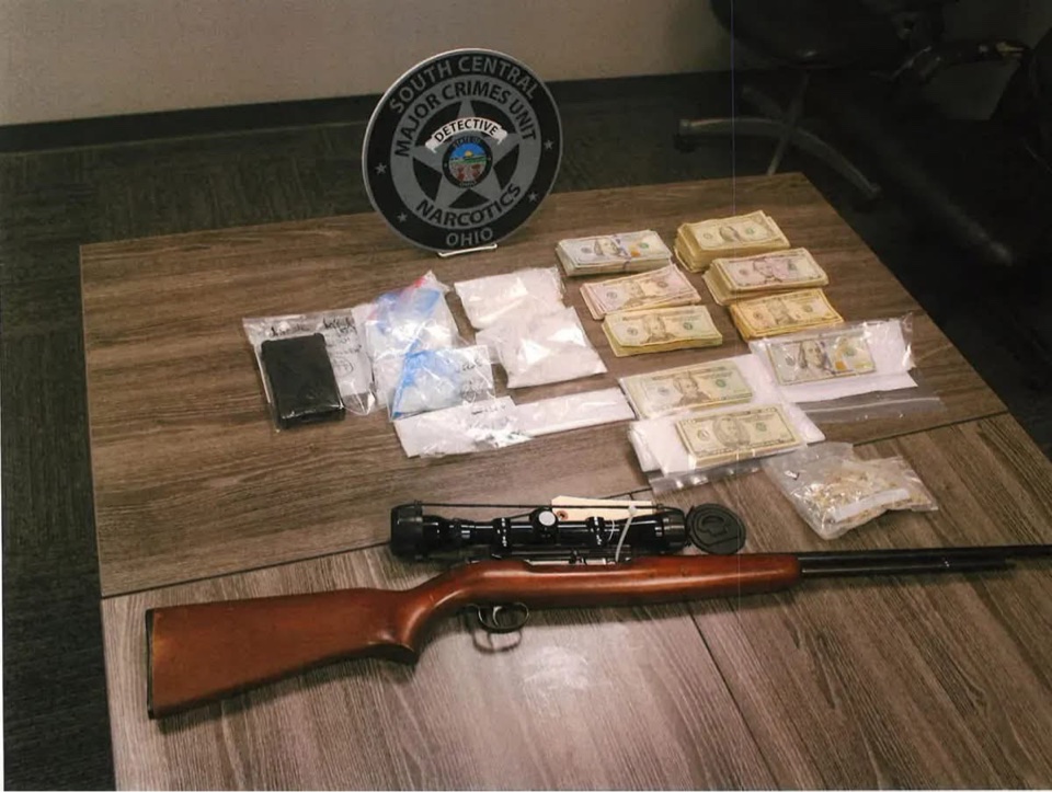 Cash, drugs and a rifle seized by the South Central Ohio Major Crimes Unit during an Oct. 12 search warrant in Thornville. (South Central Ohio Major Crimes Unit)
